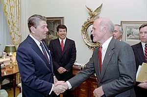 President Ronald Reagan shaking hands with John Glenn