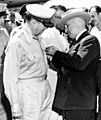 President Truman pinning medal on General MacArthur on Wake Island
