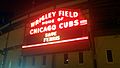 Wrigley Field at night lit up to say 'Save Ferris'