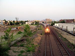 Fitchburg Line train passing Union Square station site, July 2015