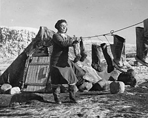 Inuit woman “Aasivak Evic” hangs kamiits (sealskin boots) to dry, Pangnirtuuq (Pangnirtung), Nunavut (30726111653)
