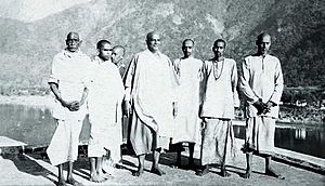 Swami Chinmayananda on his day of Sannyas initiation, with Guru Swami Sivananda and other disciples, Feb 25, 1949, Maha Shivratri Day