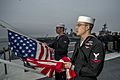 USS George HW Bush flag at half mast
