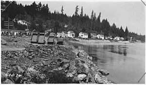 View shows in foreground rock fill slope protection at about Sta.75. Line of high stakes at toe of fill slope low... - NARA - 298221