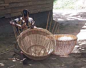 Woman weaving baskets near Lake Ossa