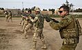 An Australian soldier, assigned to Task Group Taji, conducts bayonet training with Iraqi soldiers