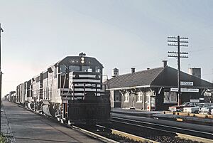 Chicago and Eastern Illinois 265 (GP35) passing the Steger, IL Depot on November 26, 1965 (27482523861)