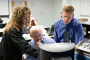 Nowak, Kelly and Lindsey review data on a computer monitor