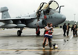 US Navy 100606-N-9860Y-002 Cmdr. Chris Bergen, from Jefferson Township, N.J. executive officer of the Wizards of Electronic Attack Squadron (VAQ) 133, is greeted by his daughter