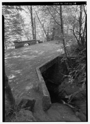 VIEW LOOKING NORTH AT REMAINS OF RUCKEL CREEK BRIDGE NEAR EAGLE CREEK. - Historic Columbia River Highway, Troutdale, Multnomah County, OR HAER ORE,26-TROUT.V,1-76