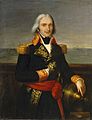 A man in an ornate naval uniform with long grey hair stands on a ship's quarterdeck.