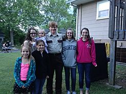 Locals pose with movie star Jesse Plemons during filming