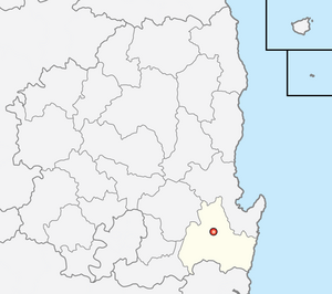 A region on an east coast is divided into 23 districts, with the southern coastal district highlighted.