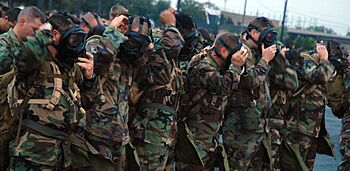 U.S. Navy Seabees assigned to Naval Mobile Construction Battalion 1 don their MCU-2P gas masks at the Naval Construction Battalion Center in Gulfport, Miss., Oct 081024-N-LD343-001