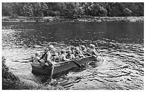 U.S. infantry soliders deploying an M2 assault boat in Europe in World War II