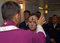 US Navy 080206-N-7869M-057 Electronics Technician 3rd Class Leila Tardieu receives the sacramental ashes during an Ash Wednesday celebration