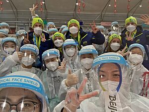 Aus team members with staff in dining hall Zhangjiakou Village (Snowboard) edit