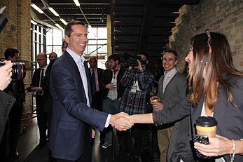 Dalton McGuinty shaking hands at Communitech Hub expansion opening