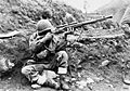 Dutch soldier returns sniper fire in Korea-1952