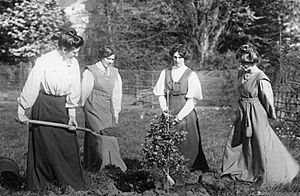 Mary Blathwayt planting tree with Vera Holmes, Jessie and Annie Kenney 1909