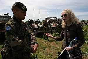 Mia Farrow in discussion with EUFOR soldier (2530868572)