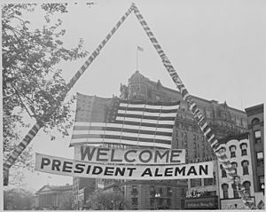 Photograph of U.S. flag and welcoming banner hung over a Washington street during ceremonies in honor of visiting... - NARA - 199565