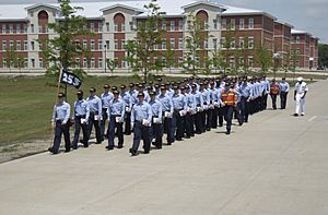 Recruits march from their ship barracks