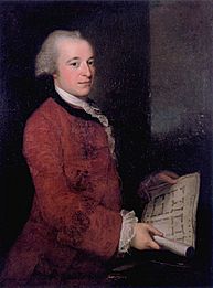 Portrait of a young man, at three-quarter length. He wears a red coat, with lace at the wrists. He holds an architectural plan. His hair is receding.
