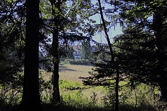 Stone building of Wilpen Hall through trees, Sewickley Heights, Pennsylvania, 2012-09-11.JPG