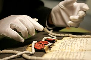 A gloved pair of hands at The National Archives