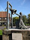 Blanche Heriot holds clapper Chertsey 2014.jpg