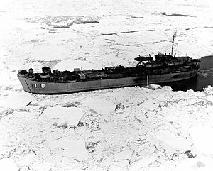 USS San Bernardino County (LST-1110) underway in a consolidated ice belt, northeast of Point Barrow, Alaska, during DEW Line support operations, 11 September 1955