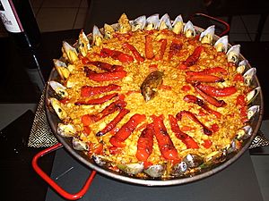 Red paella with mussels