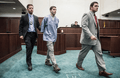US Marshals escorting prisoner in court