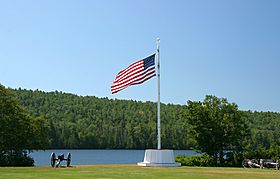 Flagpole in front of Lake Fanny Hooe at Fort Wilkins