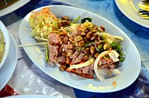 Yam naem is a Thai salad prepared with naem and other ingredients.