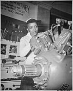 "Inspecting a Grumman Wildcat engine on display at the U.S. Naval Training School (WR) Bronx, NY, where she is a `boot' - NARA - 520638