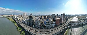 Aerial panorama of Taipei's west from the perspective of Tamsui River