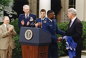 Coach Charlie Jackson and President Bill Clinton Handshake