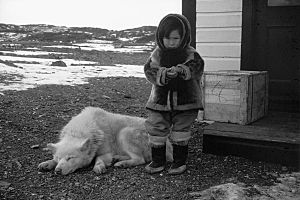 Inuit child and dog at Fort Ross, Nunavut