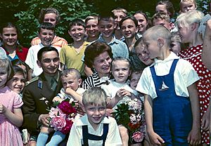 RIAN archive 619144 Cosmonauts Valentina Tereshkova and Valery Bykovsky among children