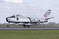 Royal Australian Air Force, on loan to the Temora Aviation Museum, (VH-IPN, former military registration A94-983) CAC Sabre Mk.32 landing at Avalon during the 2015 Australian International Airshow.jpg