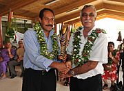 The Premier of Niue, Hon. Toke Talag hands over the Queen's Baton Delhi 2010 to the Associate Minister Of Sports Hon. Dalton Tagelagi, in Niue on May 12, 2010