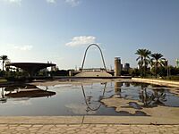 The helicopter landing apron (left) and the gateway arch to the open-air theatre at the Rashid Karami International Fair