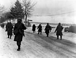 101st Airborne troops move out of Bastogne