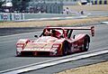 Ferrari 333 SP - Mauro Baldi, Giampero Moretti & Didier Theys head underthe Dunlop Bridge at the 1998 Le Mans (51885183588)