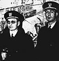 Two men in naval uniform