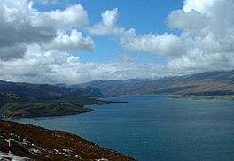 A wide sea loch surrounded by hills