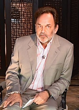 Secretaries Kerry and Pritzker sit for interview with NDTV host Prannoy Roy (cropped).jpg