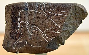 This basalt stone is incised with a scene showing two animals, probably gazelles. From Dhuweila, eastern Jordan, c. 6200 BCE. British Museum
